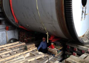 Removal and replacement of 200,000 lb. rotary kiln. Required plating and cribbing of basement area to jack and slide kiln sideways to remove, and the same process in reverse to install the new rotary kiln